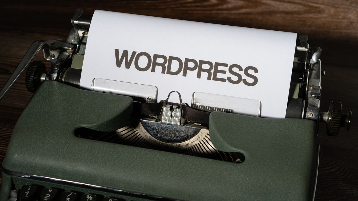 The word WordPress typed on paper in a typewriter, representing a rebuild on WordPress